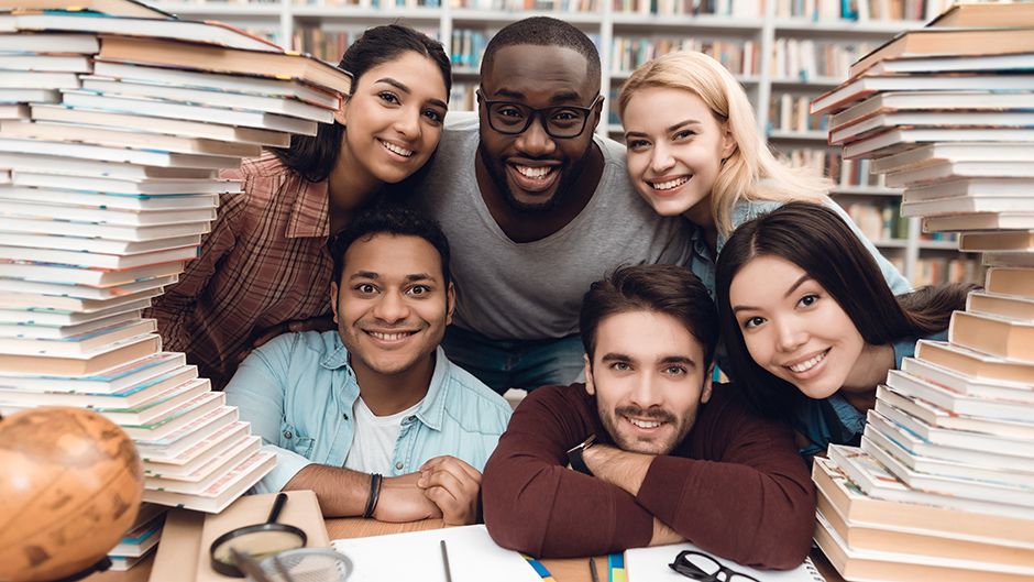 Photo of a group of students with books